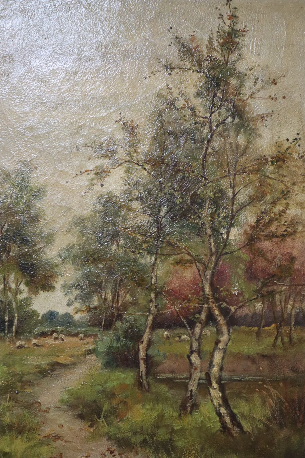 English School (19th/20th century), wooded landscape with sheep in the background grazing near a path, oil on canvas, 34 x 24cm